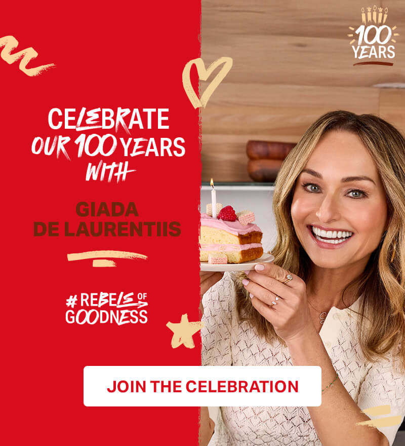 celebrate our 100 years with Giada De Laurentiis #Rebels of goodness; Giada De Laurentiis holding a cake with candle