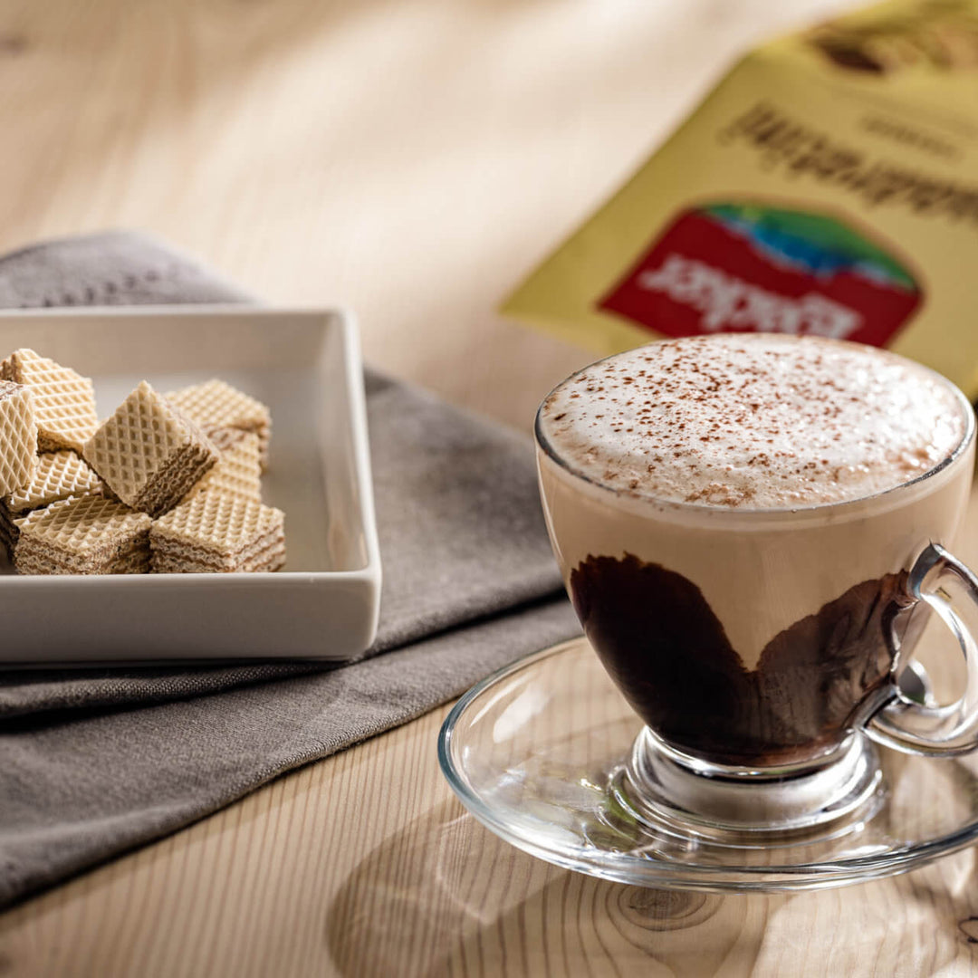 Quadratini Tiramisù, Creme-Filled Wafer Cookies, 7.76 oz. Bag with coffee next to it