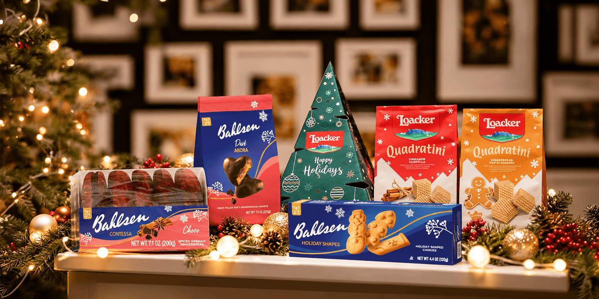 Bahlsen and Loacker holiday cookies and wafers, including gingerbread, holiday shapes and Quadratini, displayed with festive lights and Christmas decorations.