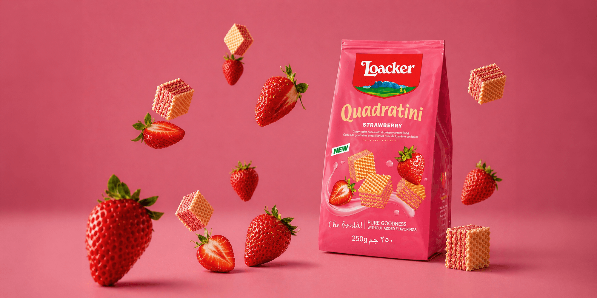 Bag of Loacker Quadratini strawberry wafers surrounded by floating strawberries and wafer cubes, set against a vibrant pink background.