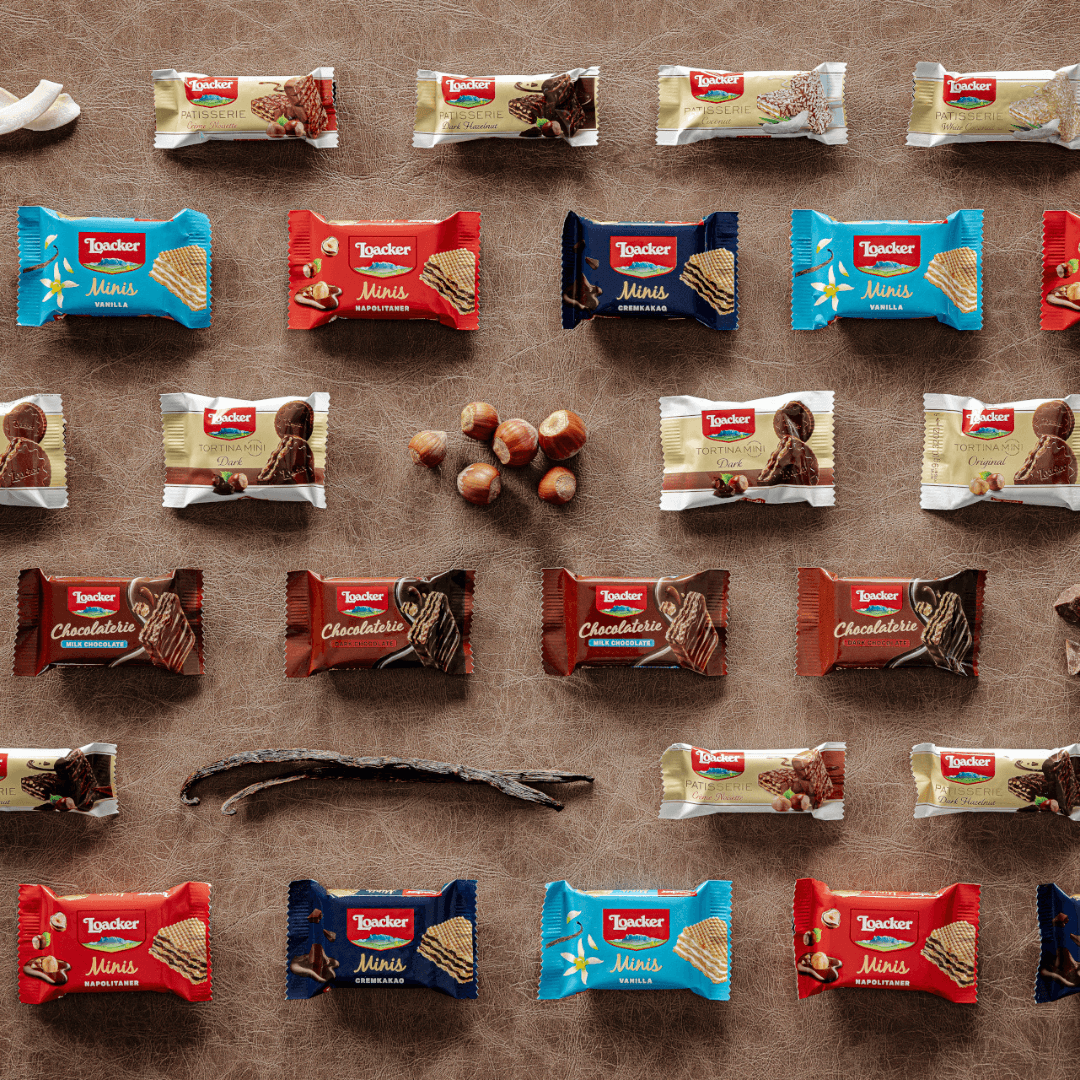 Various Loacker chocolate bars and packets arranged on a brown background