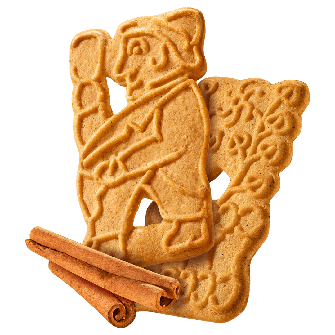 Two gingerbread cookies shaped like a bear and a cub with cinnamon sticks 