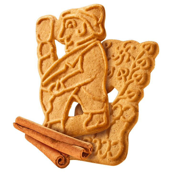 Two gingerbread cookies shaped like a bear and a cub with cinnamon sticks 