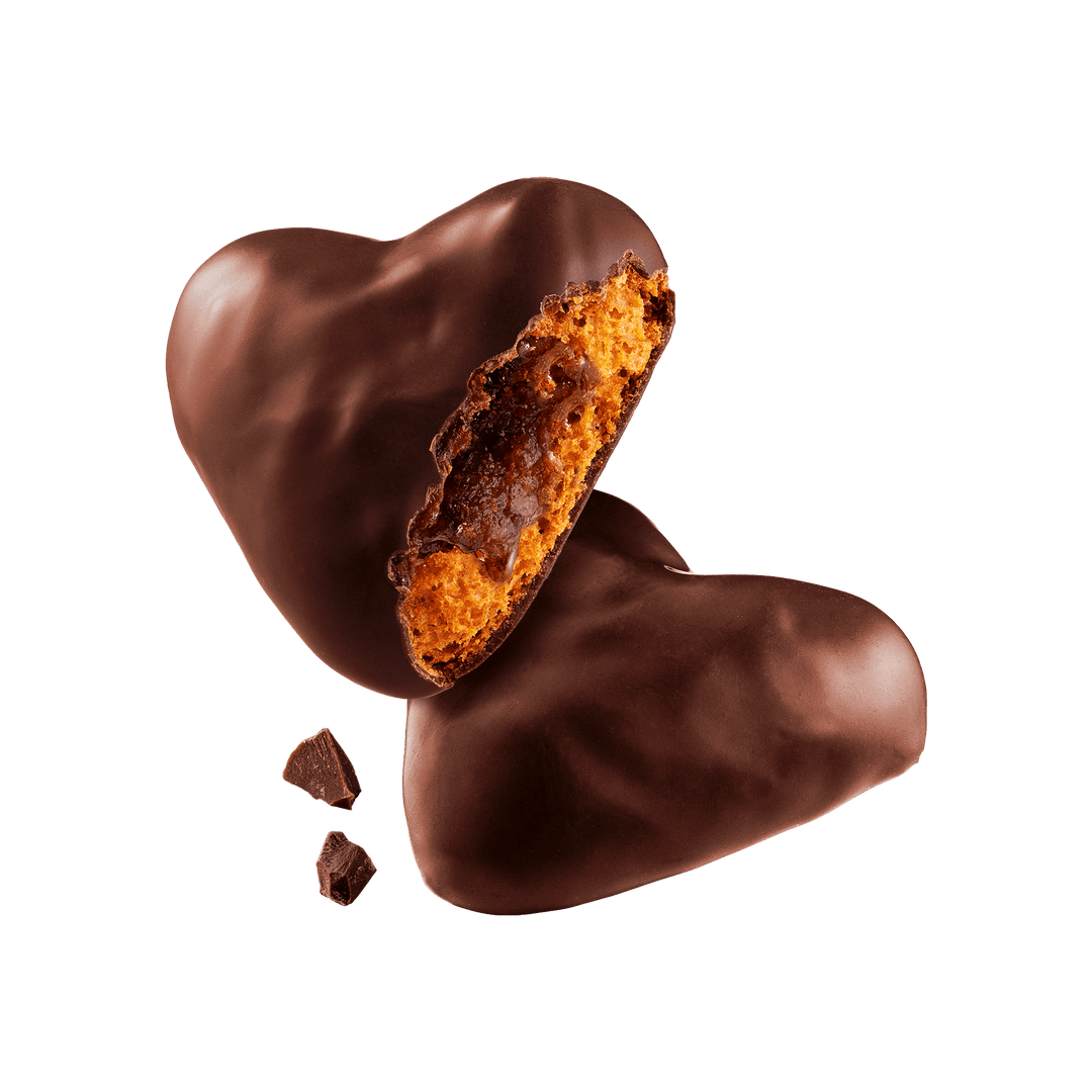 Heart-shaped chocolate candy with a visible filling 
