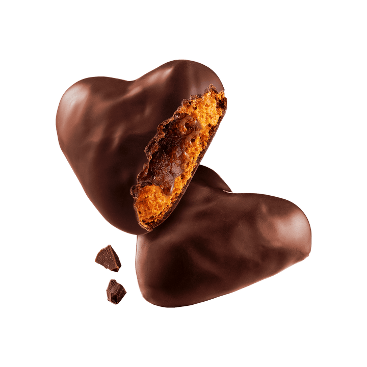 Heart-shaped chocolate candy with a visible filling 