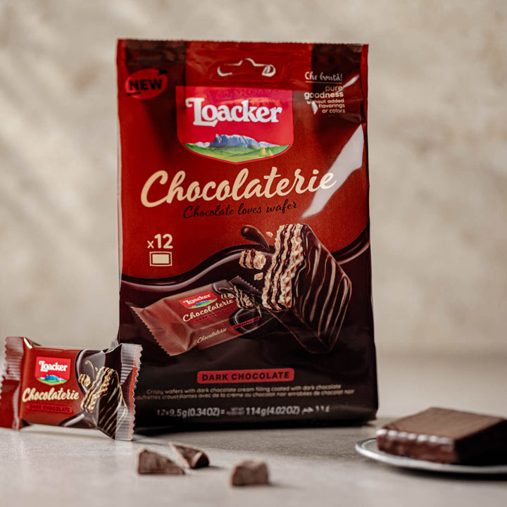 Chocolaterie Dark Chocolate, Chocolate Covered Wafer Squares, 12-ct. Bag with unwrapped wafer next to it
