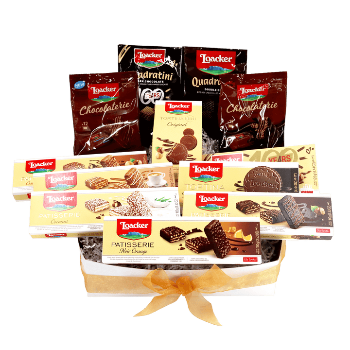 Assorted Loacker chocolate and cookie packages called The Grand Chocolate Indulgence Gift Box displayed in a decorative box.