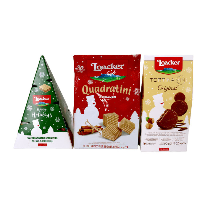 Loacker holiday assortment featuring Christmas tree-shaped wafer gift packaging, Quadratini Cinnamon wafer cubes, and Tortina Mini Original chocolate-covered hazelnut wafers.